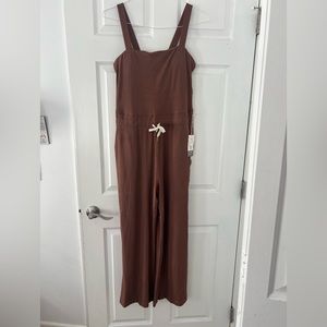Hazelnut colored Vuori jumpsuit. Brand new with tags!